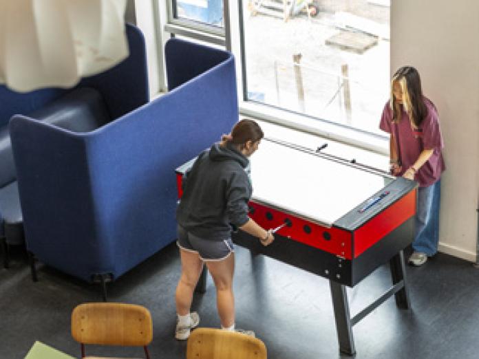 Students playing table football