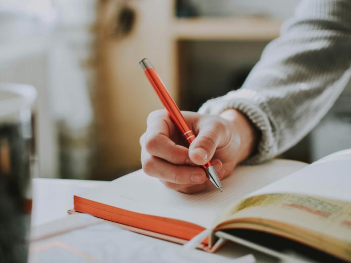 Writing in a notebook