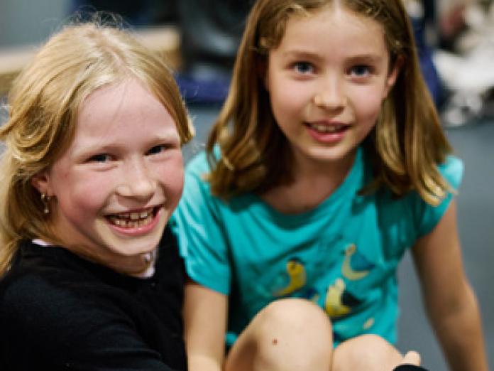 Two students smiling